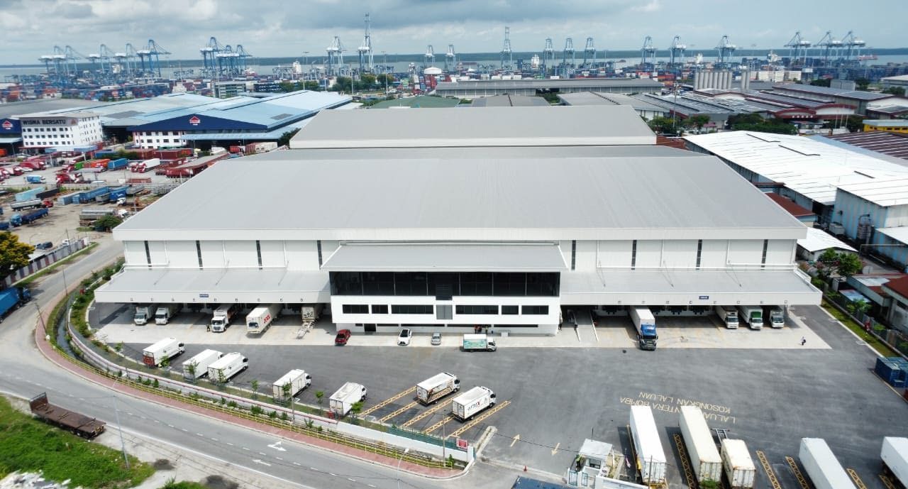 Aerial view of Northport Logistics Hub with the Port Klang container cranes behind it